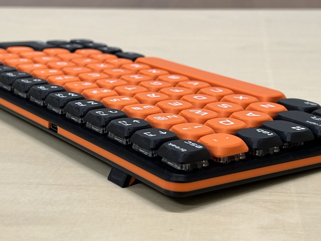 Mini Mighty Keyboard, Black Orange — underside, laid flat, close-up