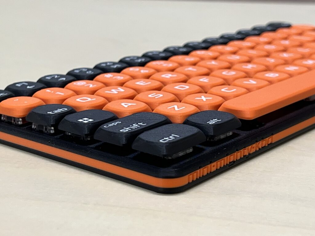 Mini Mighty Keyboard, Black Orange — laid flat, close-up