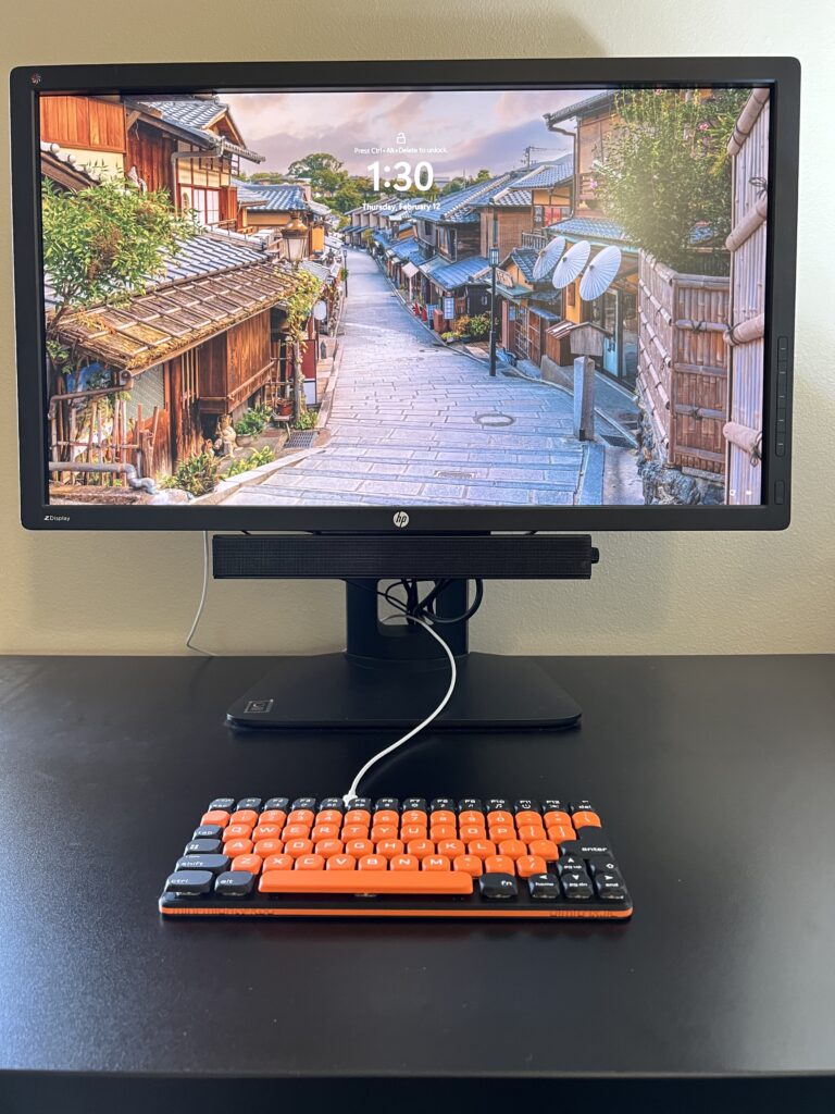 Mini Mighty Keyboard, Black Orange — on a desk