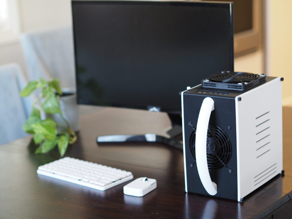 Mini Mighty Rig, Black and White — assembled with keyboard, on a desk