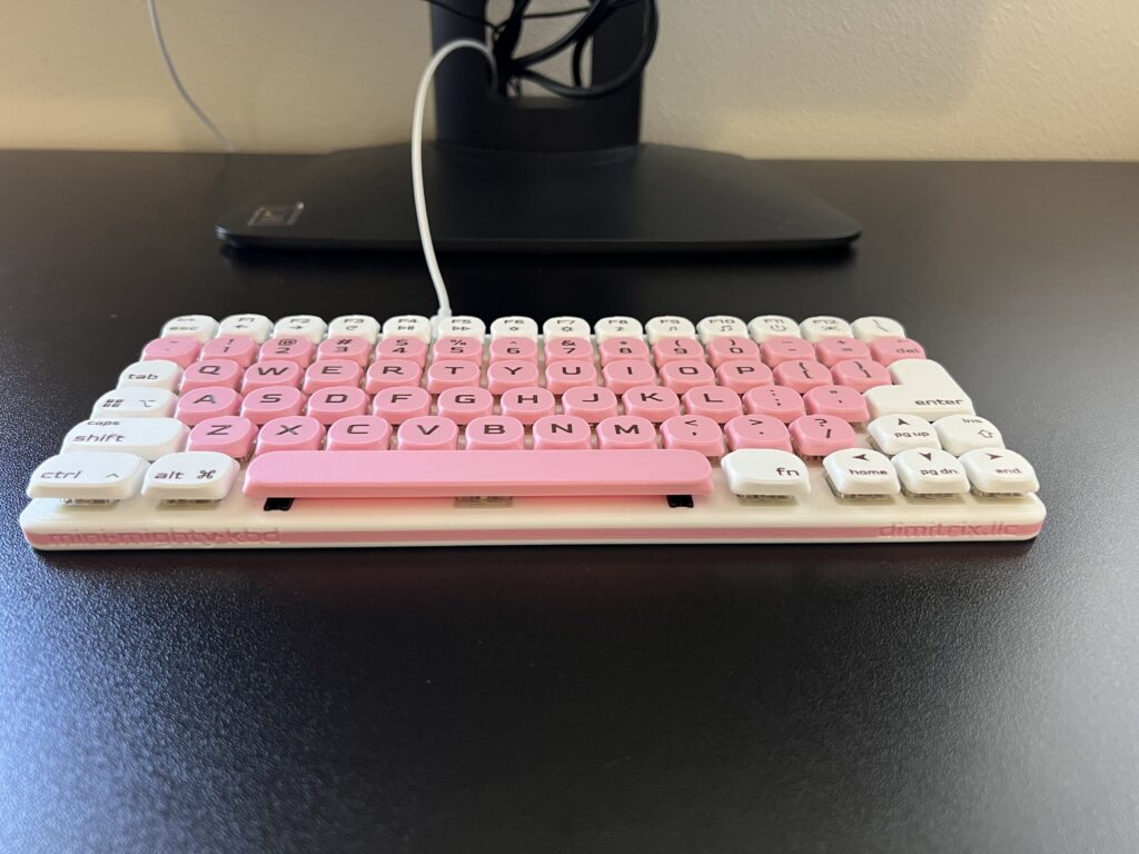 Mini Mighty Keyboard, Cherry Blossom v2 — on a desk, close-up